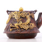 An exquisite gilt bronze teapot with auspicious clouds and dragon pattern