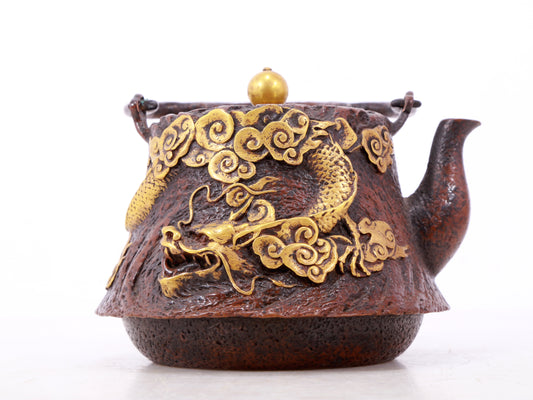 An exquisite gilt bronze teapot with auspicious clouds and dragon pattern