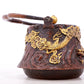 An exquisite gilt bronze teapot with auspicious clouds and dragon pattern