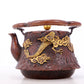 An exquisite gilt bronze teapot with auspicious clouds and dragon pattern