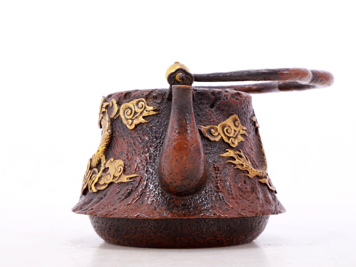 An exquisite gilt bronze teapot with auspicious clouds and dragon pattern