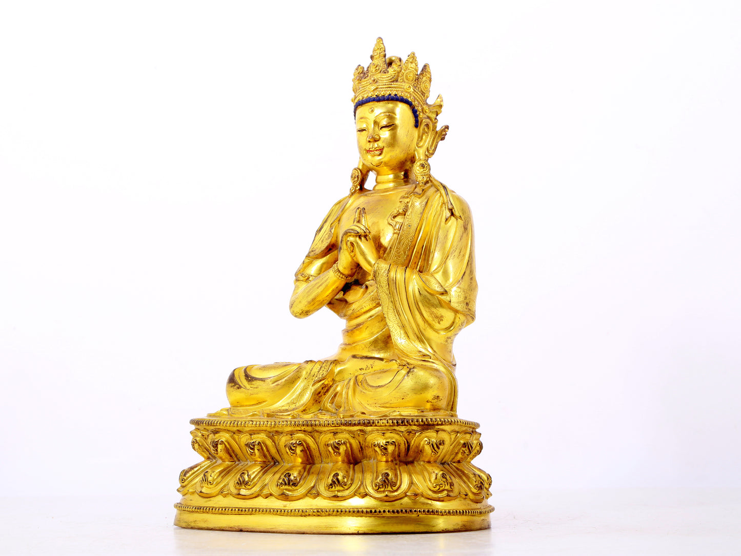 A solemn gilt bronze statue of Bodhisattva