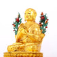 A solemn gilt bronze statue of the Guru