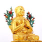 A solemn gilt bronze statue of the Guru