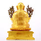 A solemn gilt bronze statue of the Guru