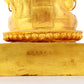 A solemn gilt bronze statue of the Guru