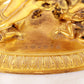 A majestic gilt bronze statue of the joyful Buddha