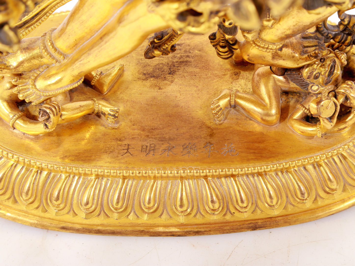 A majestic gilt bronze statue of the joyful Buddha