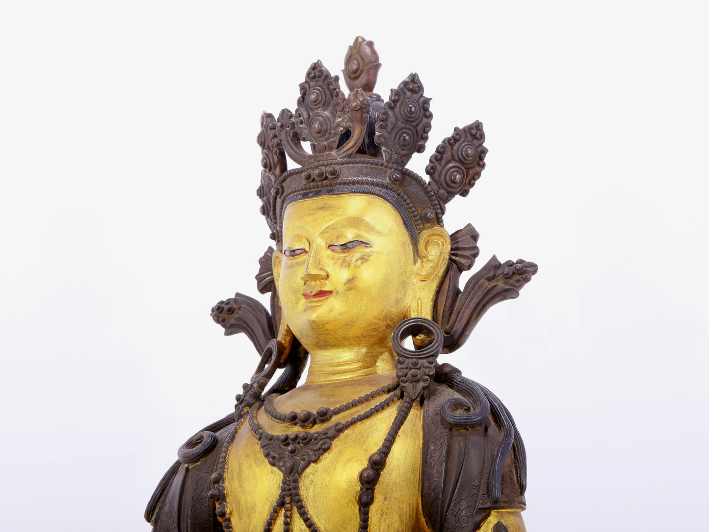 A solemn gilt bronze statue of Bodhisattva