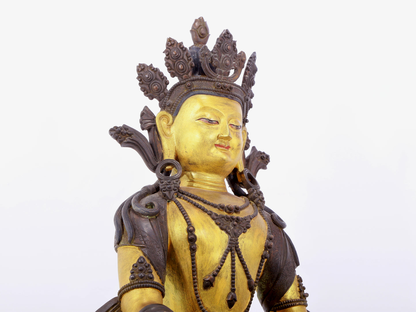 A solemn gilt bronze statue of Bodhisattva