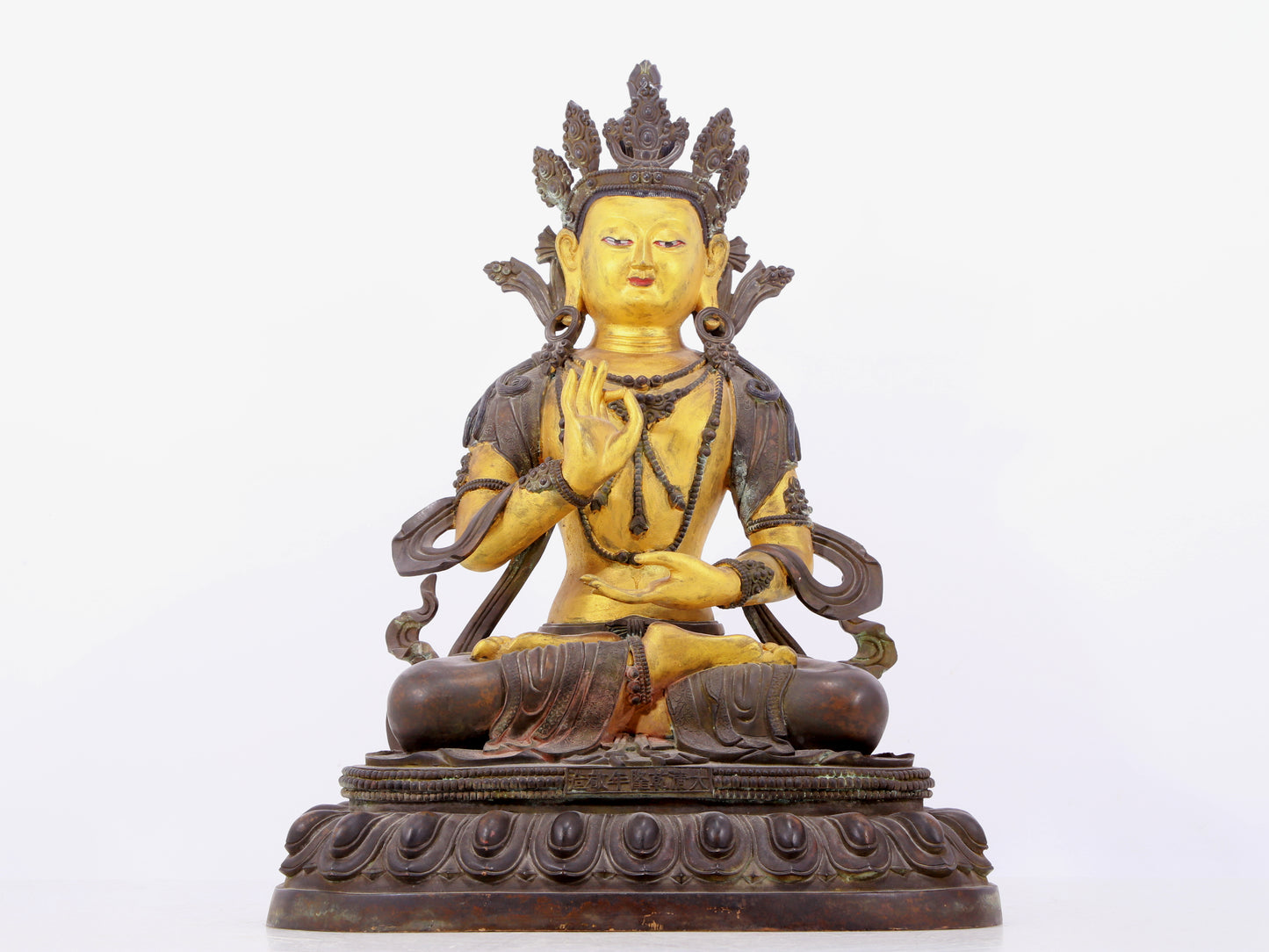 A solemn gilt bronze statue of Bodhisattva