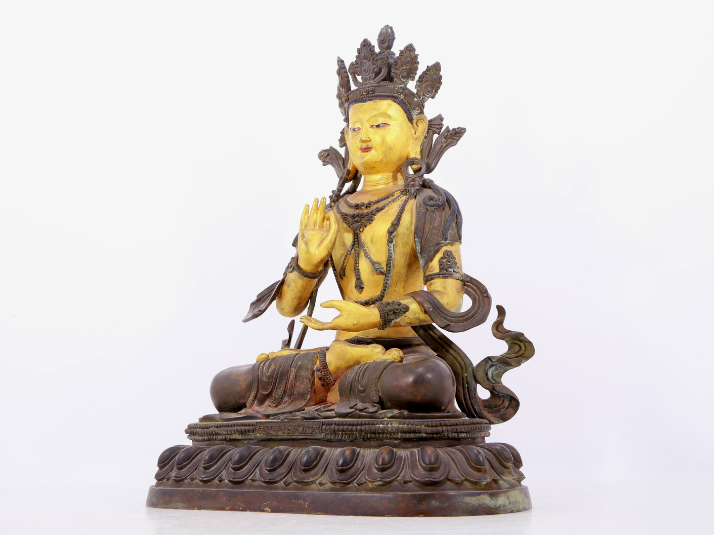 A solemn gilt bronze statue of Bodhisattva