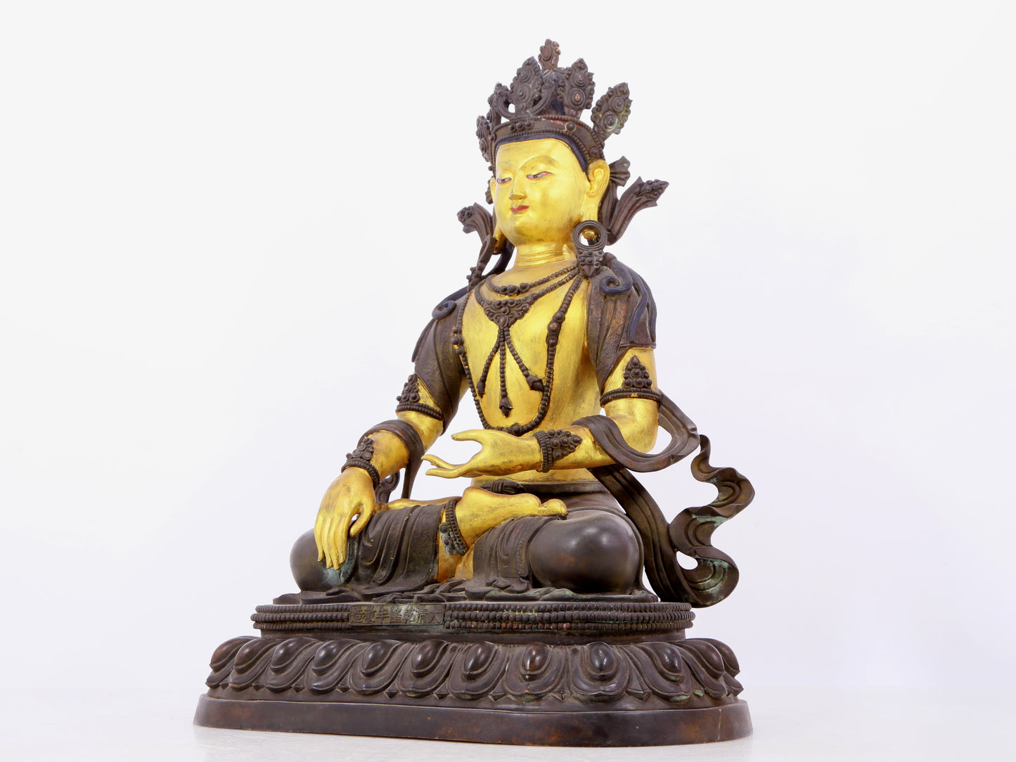 A solemn gilt bronze statue of Bodhisattva