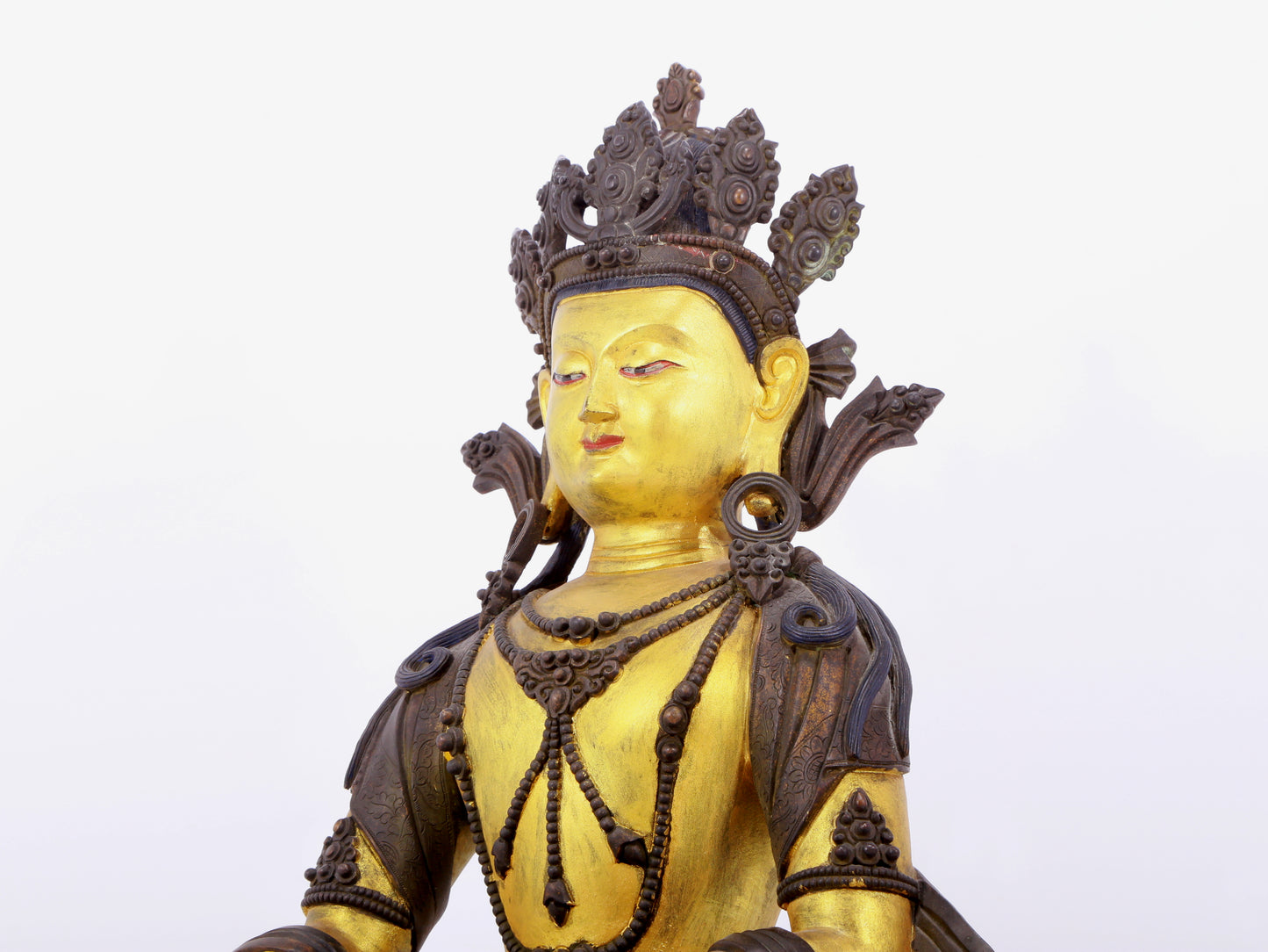 A solemn gilt bronze statue of Bodhisattva