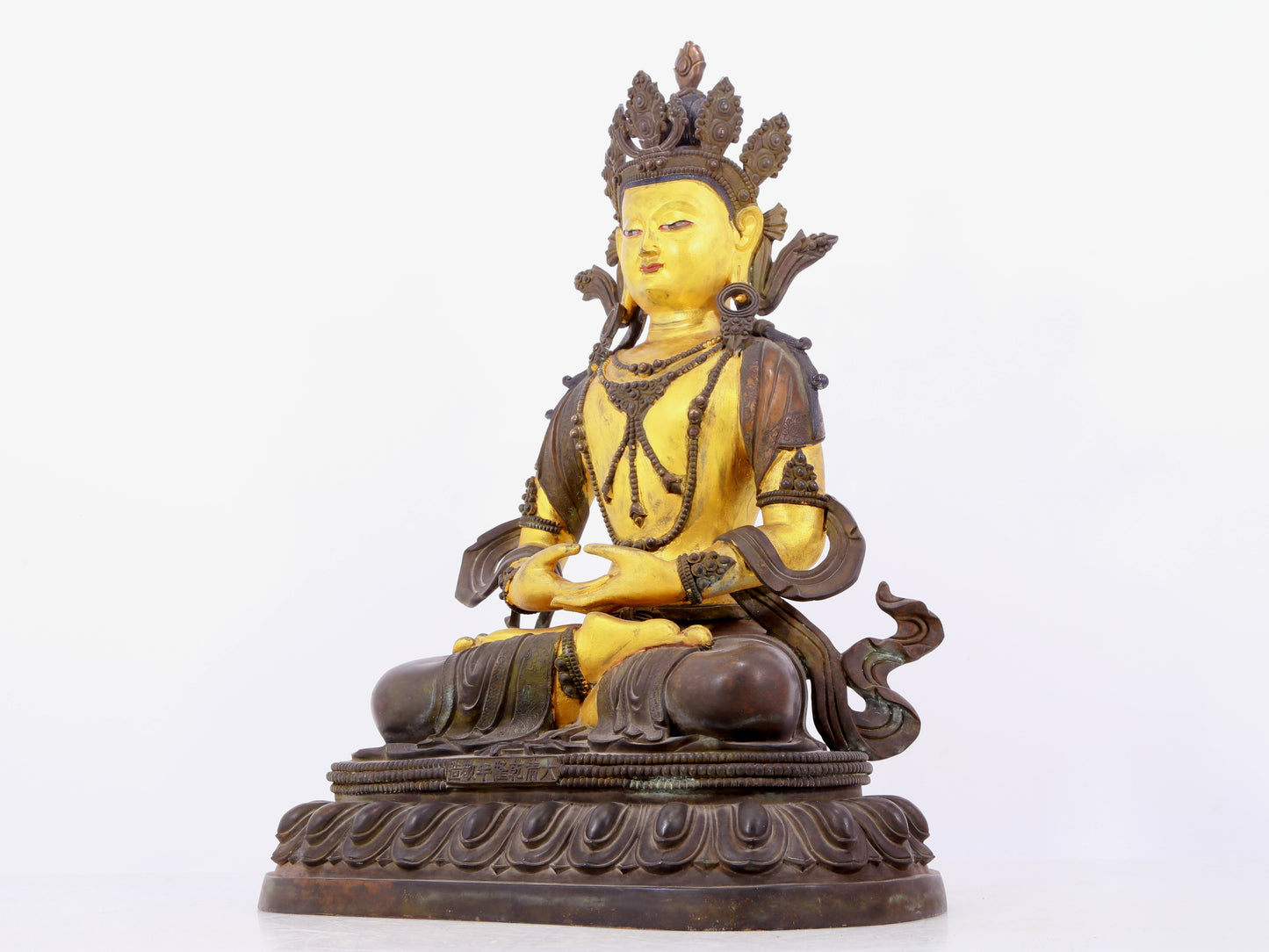 A solemn gilt bronze statue of Bodhisattva