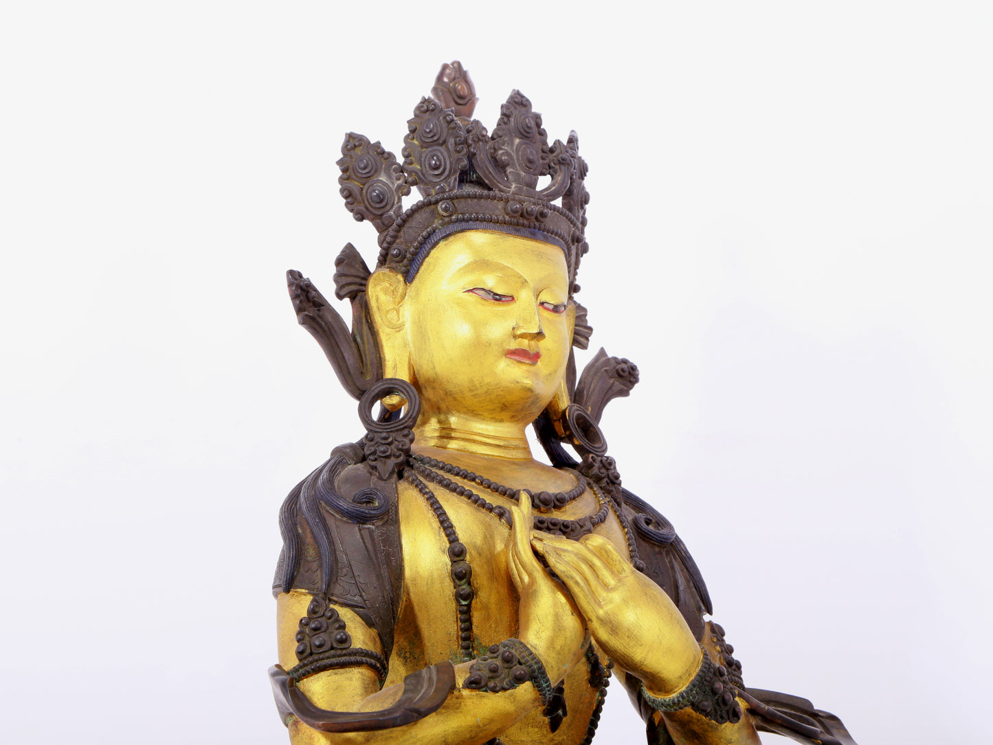 A solemn gilt bronze statue of Bodhisattva