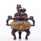 An exquisite gilt bronze censer with double ears and three legs with lotus and auspicious animal patterns.