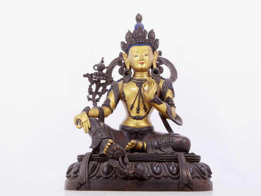 A solemn gilt bronze statue of green Tara