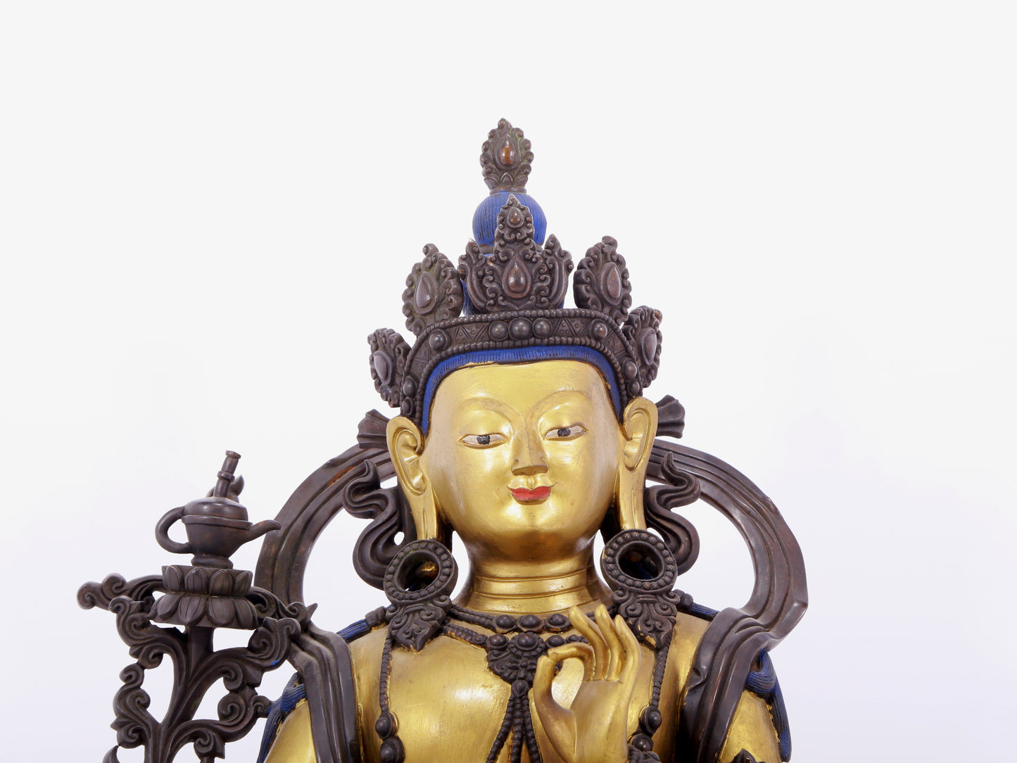 A solemn gilt bronze statue of green Tara