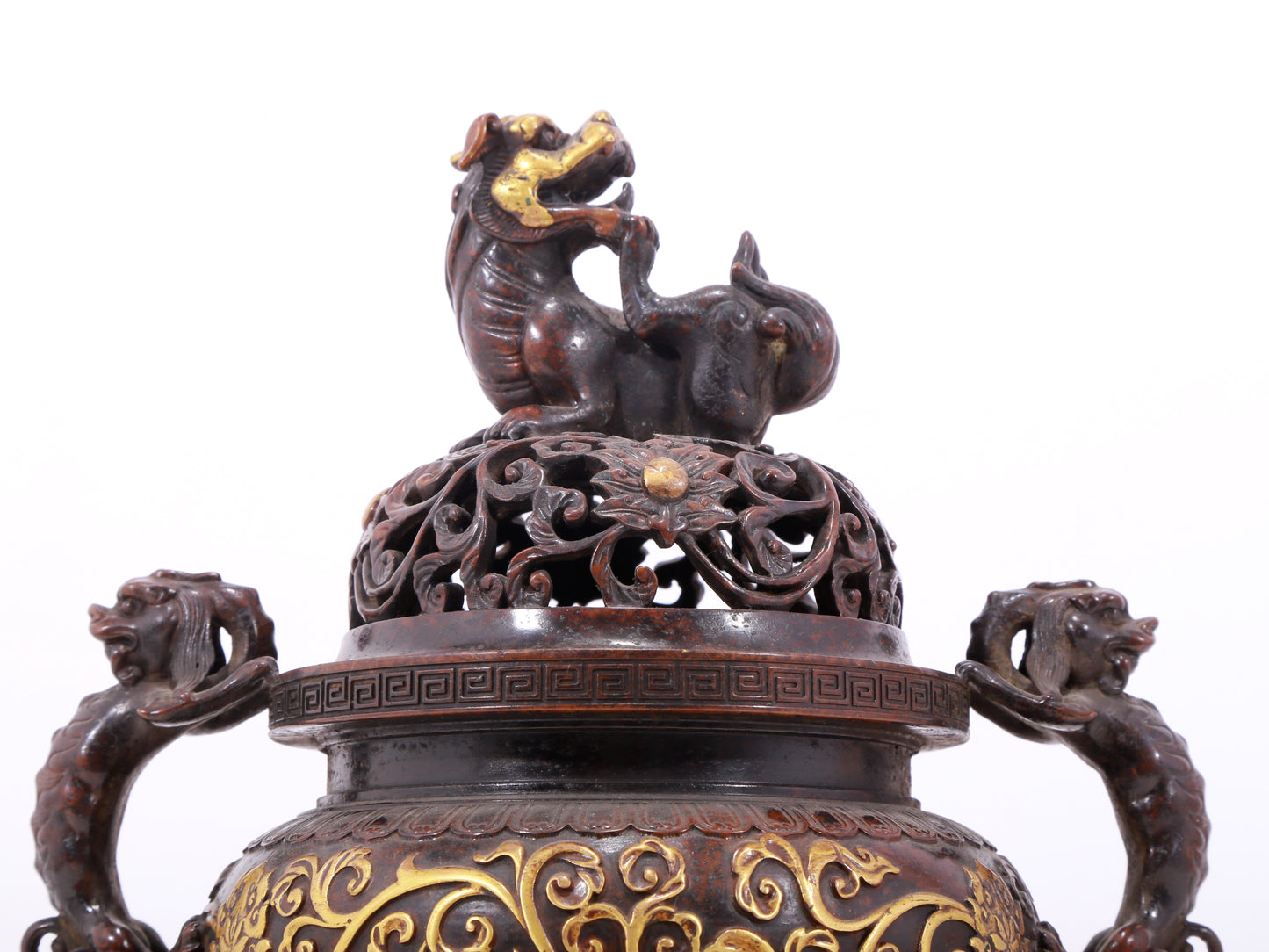 An exquisite gilt bronze censer with double ears and three legs with lotus and auspicious animal patterns.