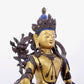 A solemn gilt bronze statue of green Tara