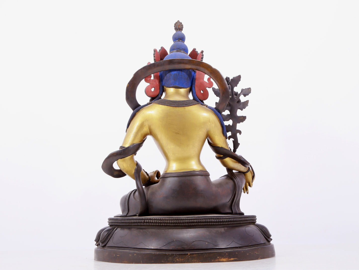 A solemn gilt bronze statue of green Tara