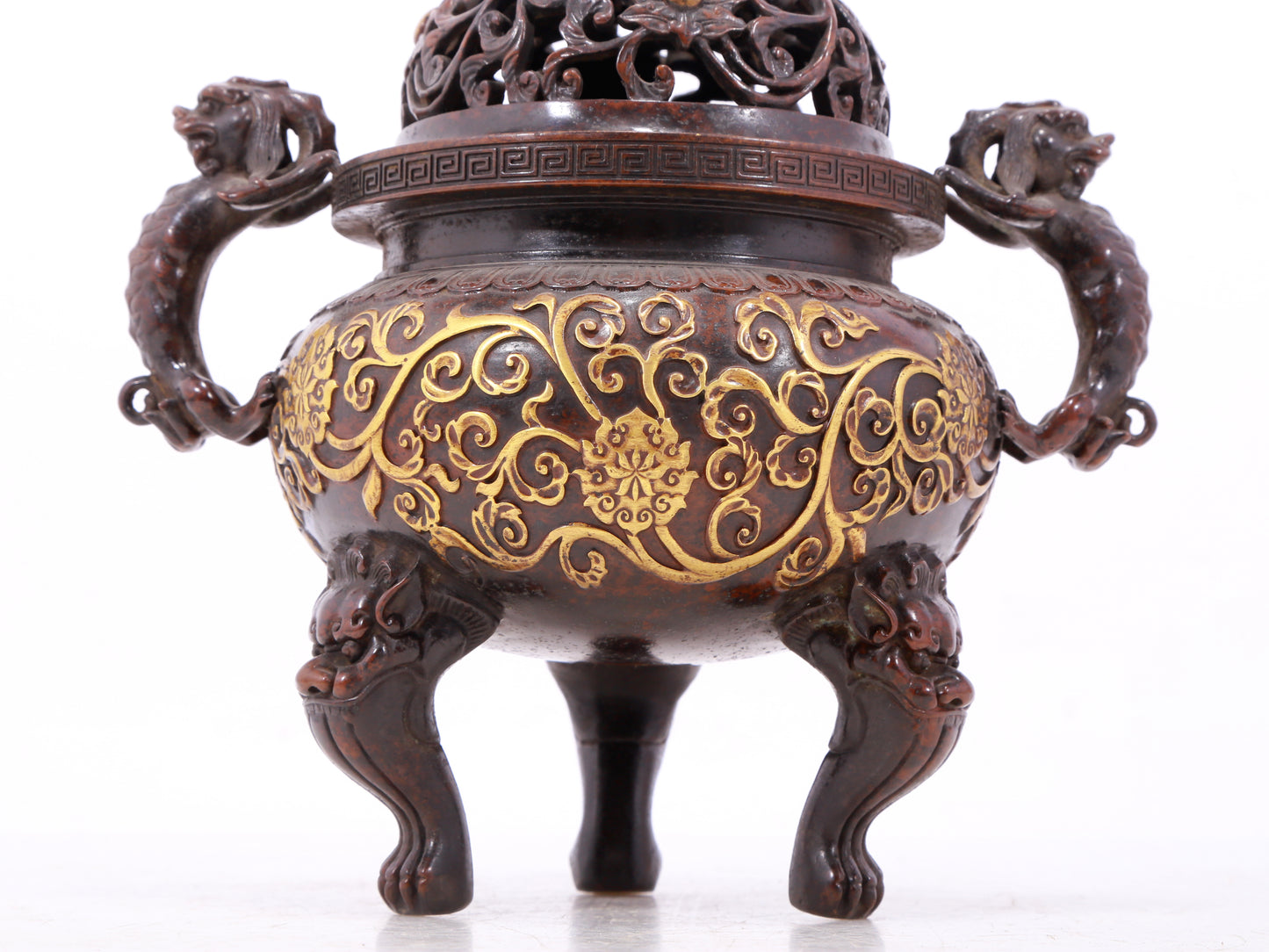 An exquisite gilt bronze censer with double ears and three legs with lotus and auspicious animal patterns.