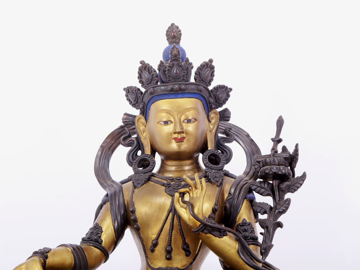 A solemn gilt bronze statue of green Tara