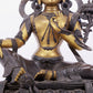 A solemn gilt bronze statue of green Tara