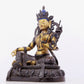 A solemn gilt bronze statue of green Tara