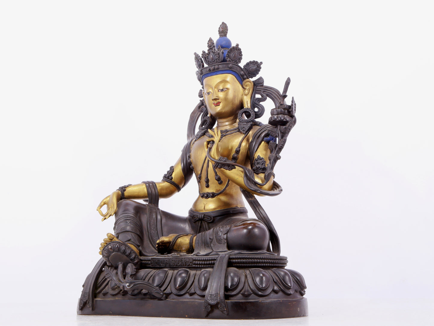 A solemn gilt bronze statue of green Tara