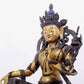 A solemn gilt bronze statue of green Tara