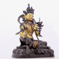 A solemn gilt bronze statue of green Tara