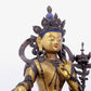 A solemn gilt bronze statue of green Tara