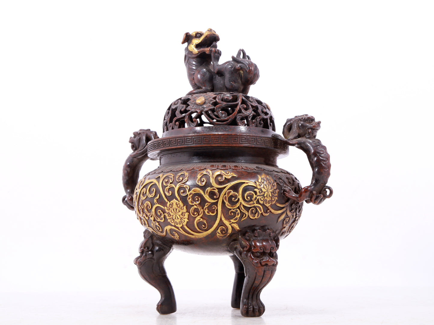 An exquisite gilt bronze censer with double ears and three legs with lotus and auspicious animal patterns.