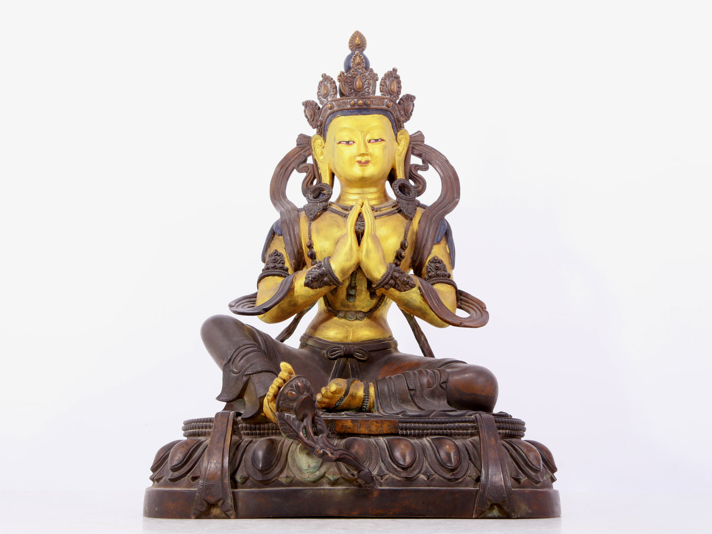 A solemn gilt bronze statue of green Tara