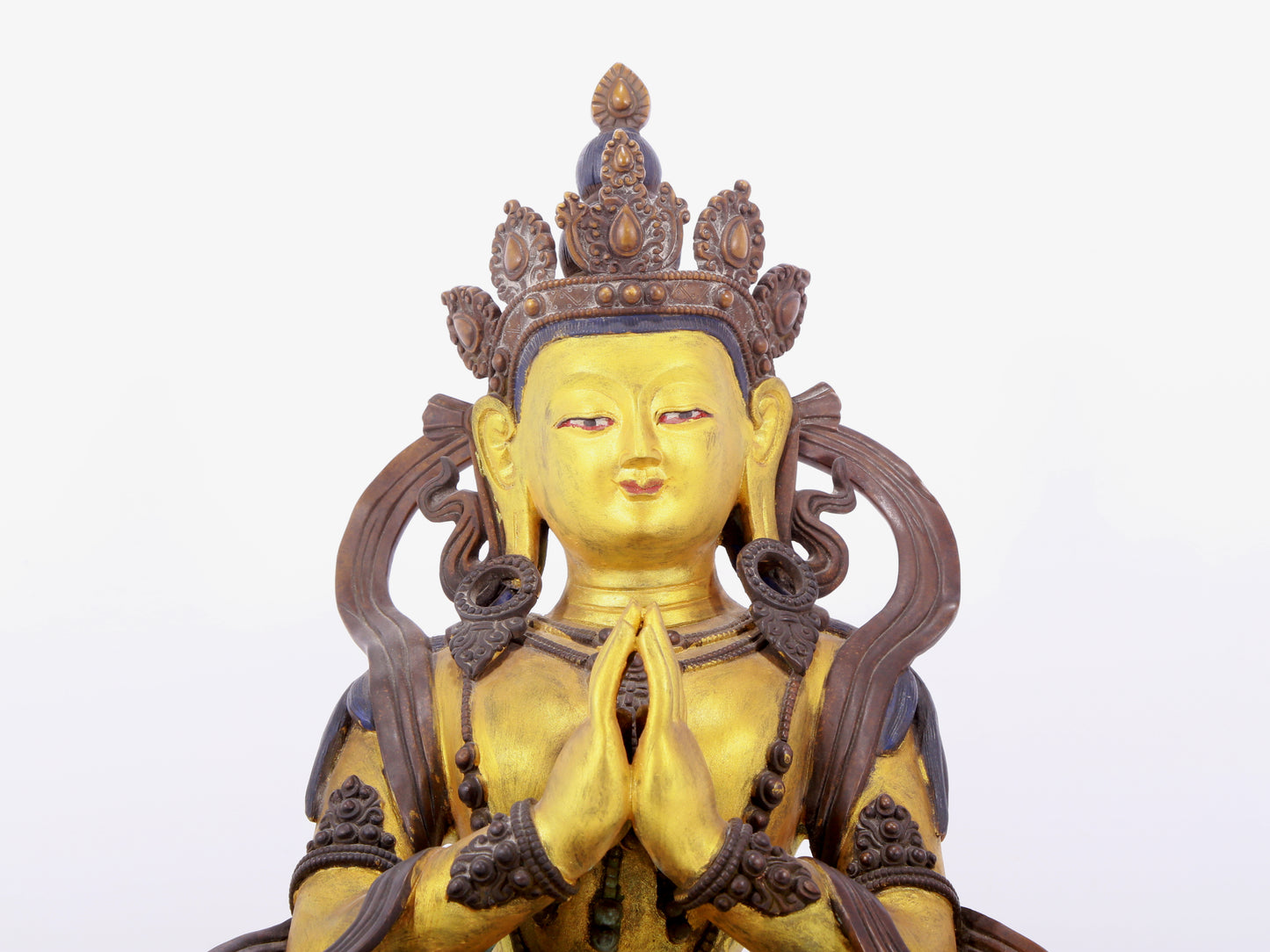 A solemn gilt bronze statue of green Tara