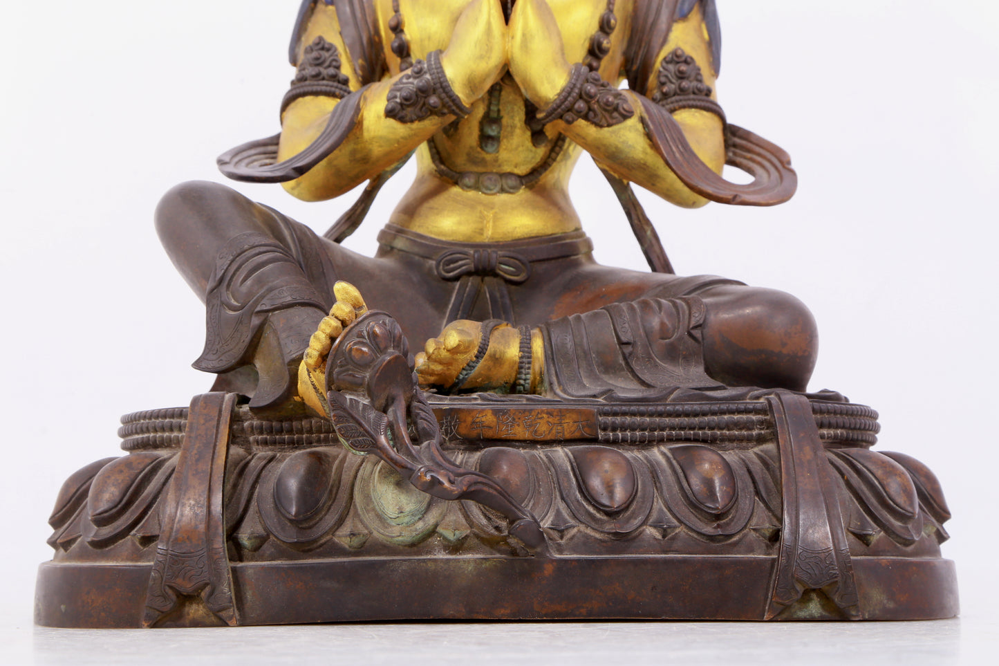 A solemn gilt bronze statue of green Tara