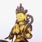 A solemn gilt bronze statue of green Tara