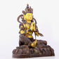 A solemn gilt bronze statue of green Tara