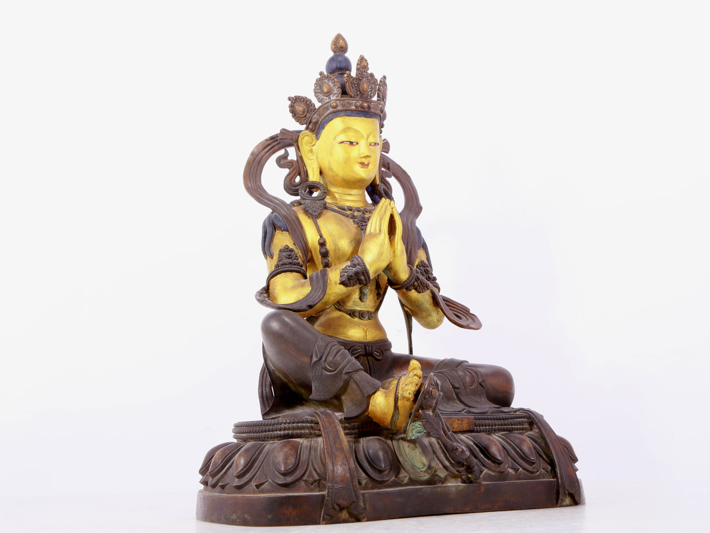 A solemn gilt bronze statue of green Tara