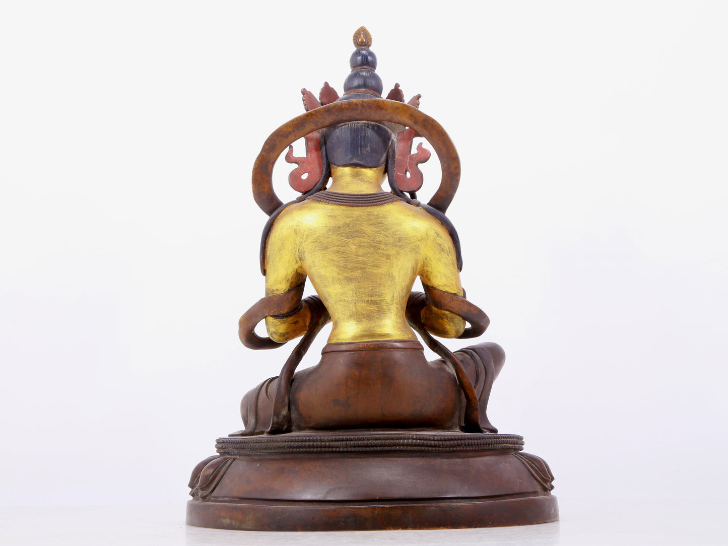 A solemn gilt bronze statue of green Tara