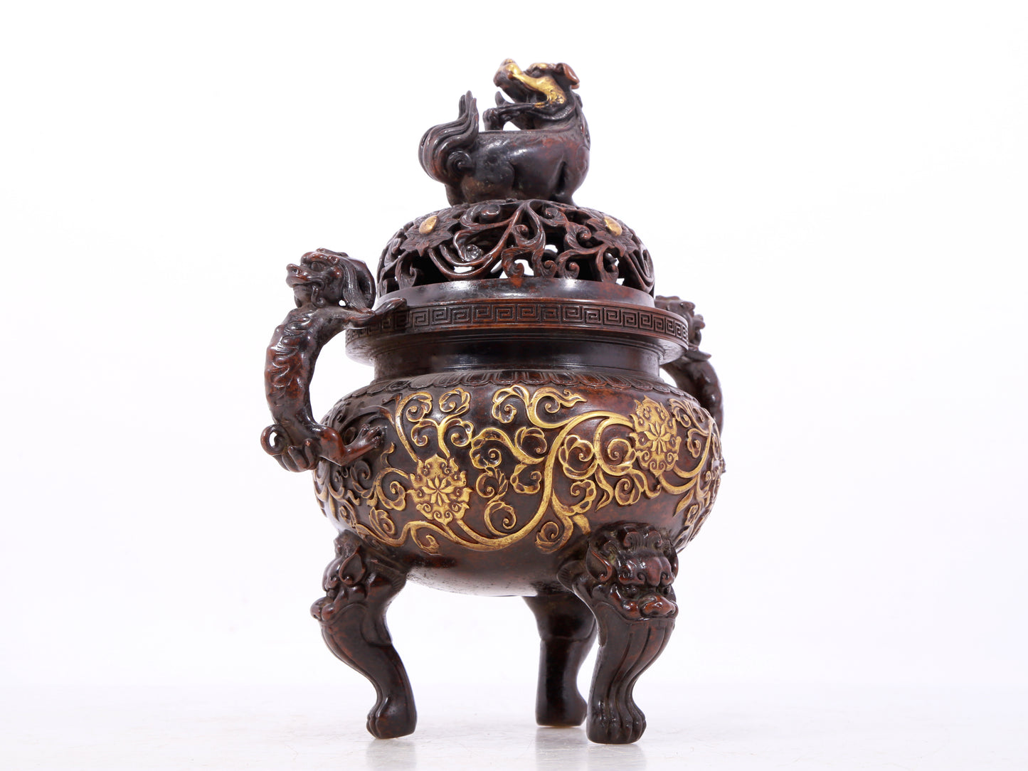 An exquisite gilt bronze censer with double ears and three legs with lotus and auspicious animal patterns.