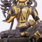 A solemn gilt bronze statue of green Tara