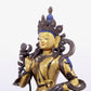 A solemn gilt bronze statue of green Tara