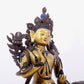 A solemn gilt bronze statue of green Tara