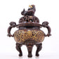 An exquisite gilt bronze censer with double ears and three legs with lotus and auspicious animal patterns.