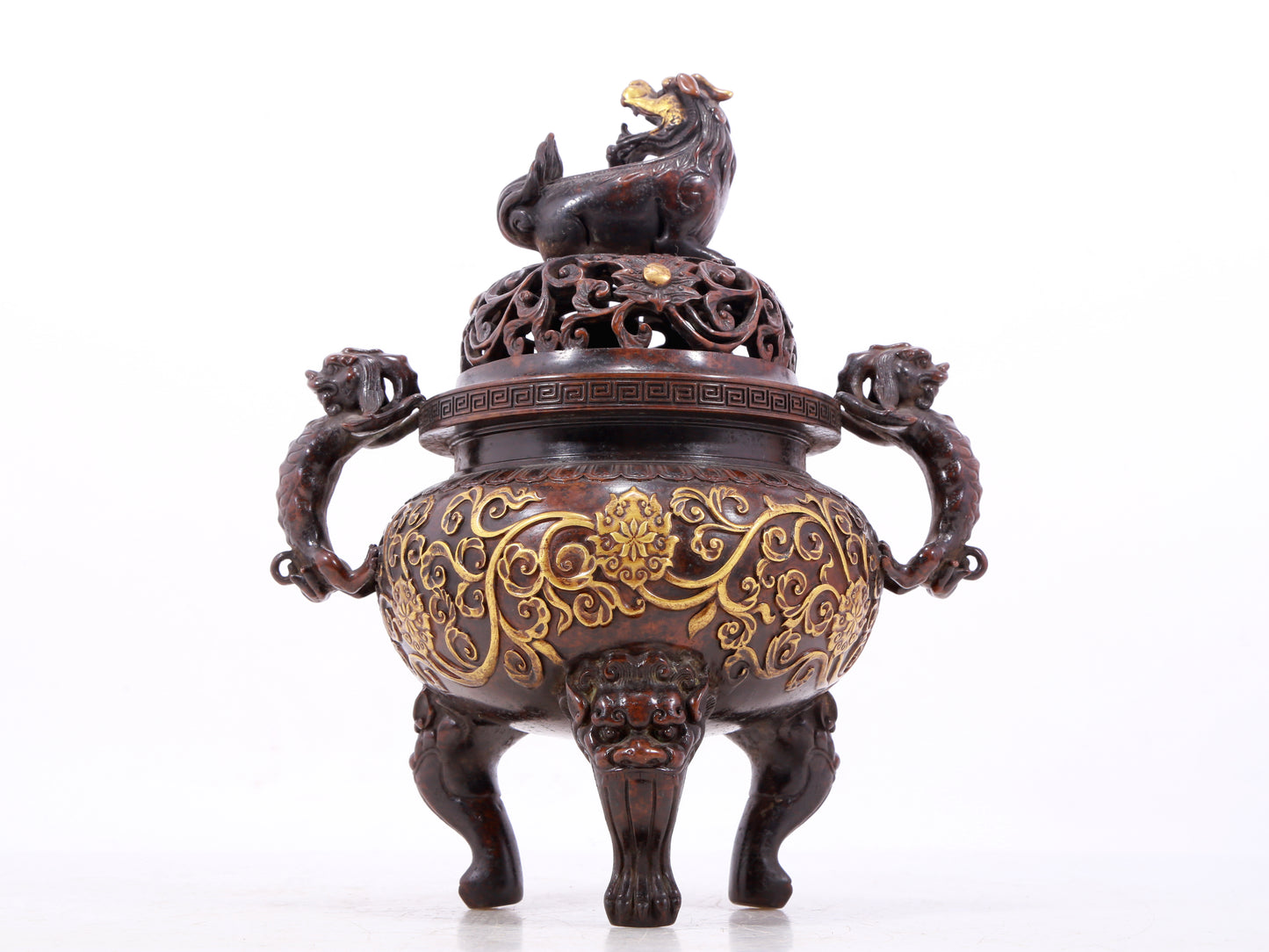 An exquisite gilt bronze censer with double ears and three legs with lotus and auspicious animal patterns.