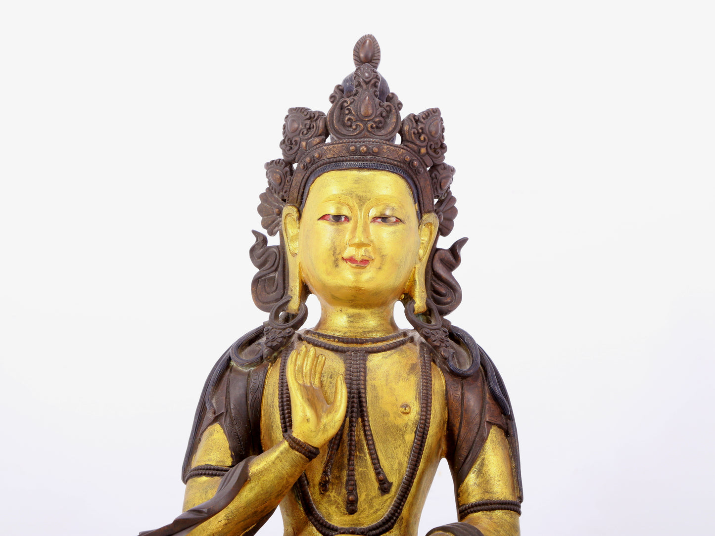 A solemn gilt bronze statue of Bodhisattva