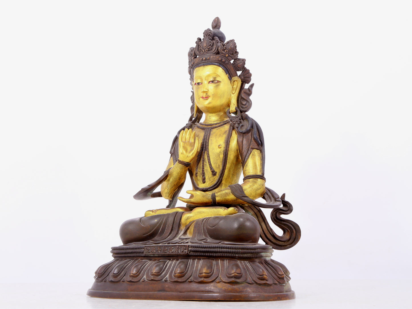 A solemn gilt bronze statue of Bodhisattva